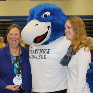 Two guests with Hartwick mascot, Swoop, during True Blue Weekend 2016