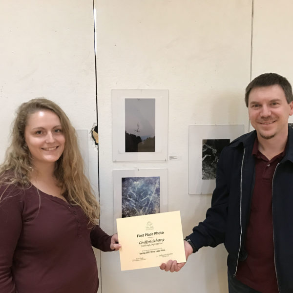 The 2017 Pine Lake Photo Contest. Caitlyn Schanz ’19, first place winner, with Kevin Gray, the evening's master of ceremonies.