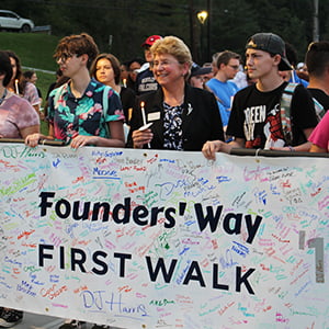 President Drugovich is joined by Emma Dias ’22, Naomi Singer ’22, Tobin Santoro ’22, and Joanna Shaffer ’22 during First Walk on Founders' Way