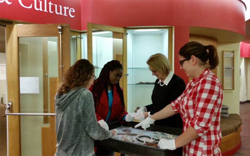 Hartwick College museum studies students installing exhibit