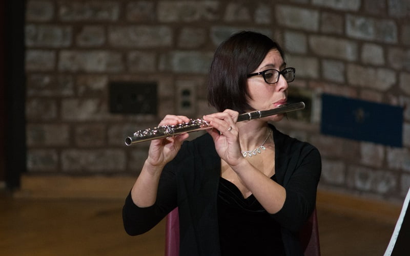 Music faculty member playing flute