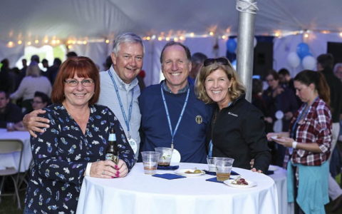 Smiling alumni at reception during True Blue Weekend