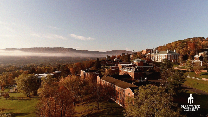 Hartwick College campus on Oyaron Hill in the fall mist desktop device wallpaper