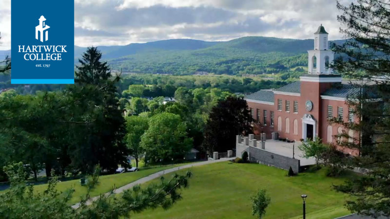 Hartwick College Zoom background photo of Yager Hall on campus in spring