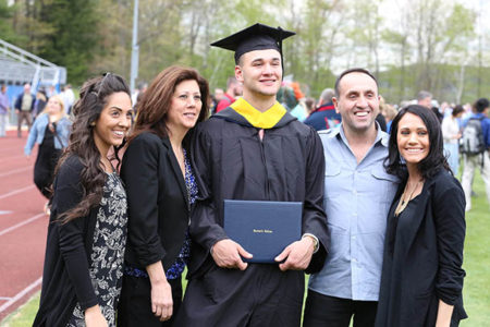 Hartwick College family with graduate after Commencement