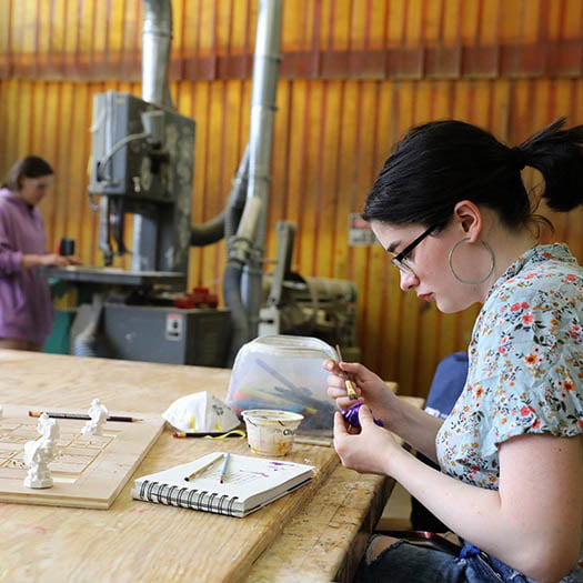 Hartwick College art student working in Fab Lab