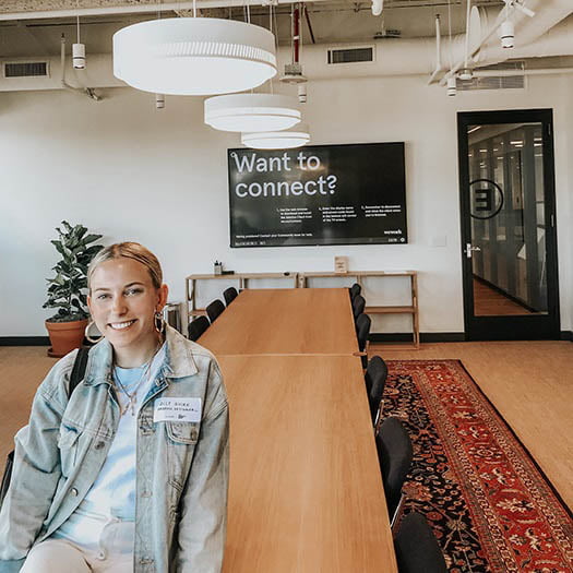 Hartwick College student in conference room during Baker-Simpson Leadership experience