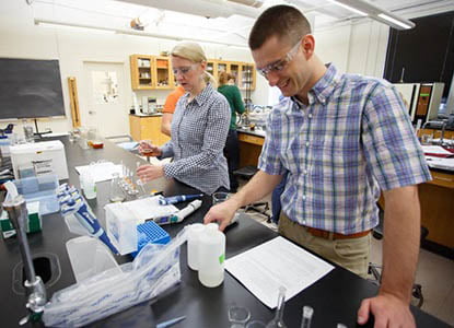Hartwick College faculty and student in chemistry lab