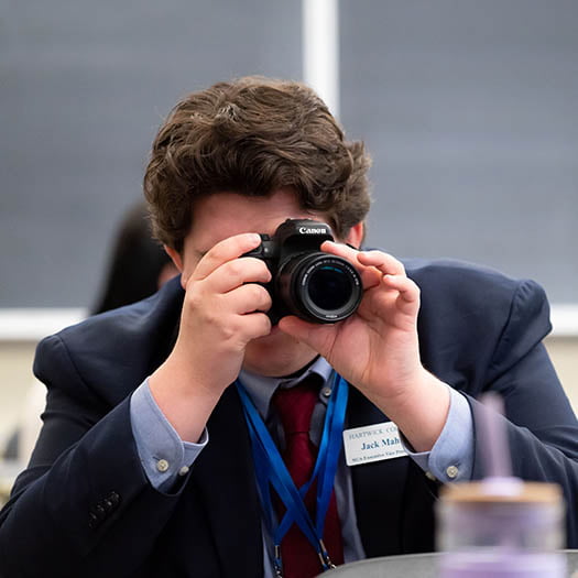 Hartwick College student taking photo