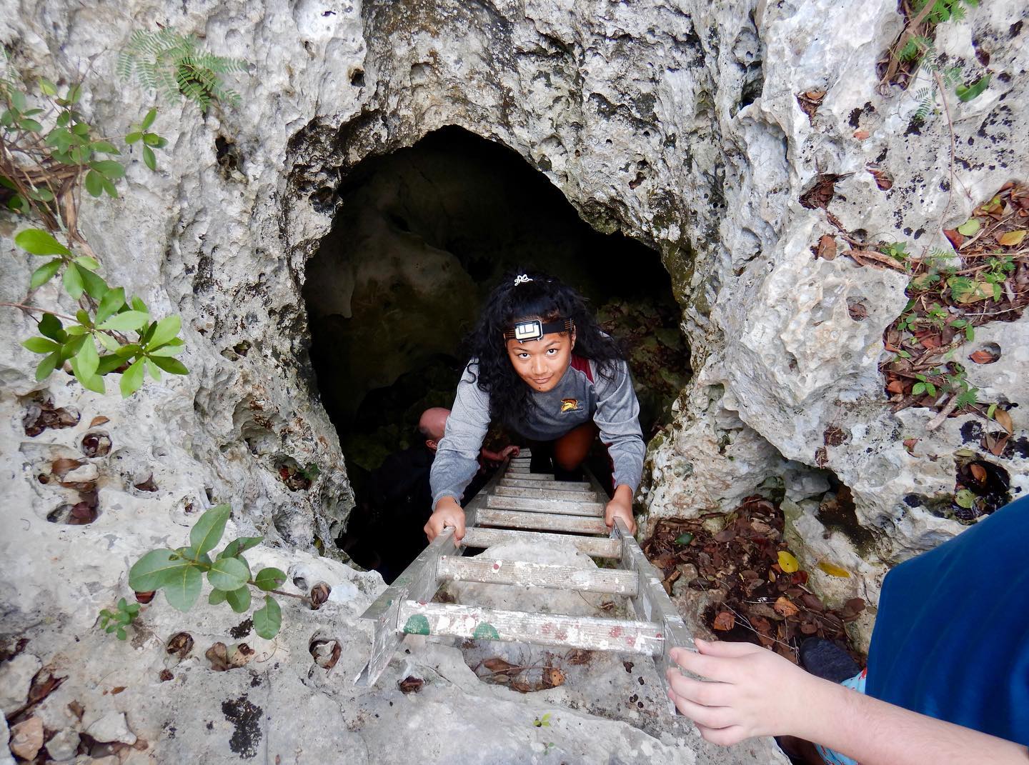 Hartwick College student on cave ladder in Bahamas during J Term