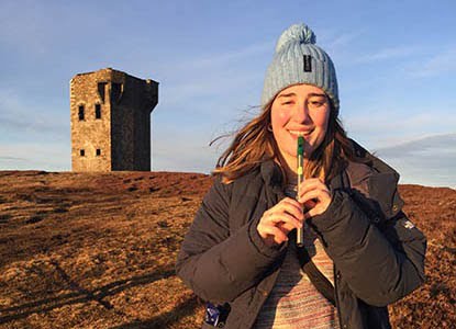 Hartwick student in Ireland playing whistle
