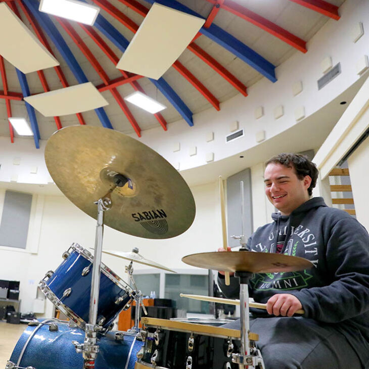 Hartwick music student playing drums