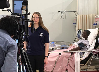 Hartwick College student being interviewed in Sim Lab