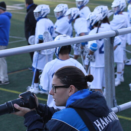 Student photographer captures lacrosse action photos.