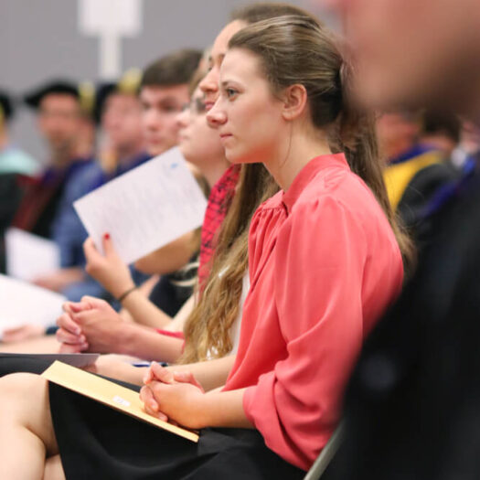 woman sitting at conference