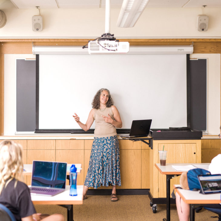 Carli Ficano teaching in class with students