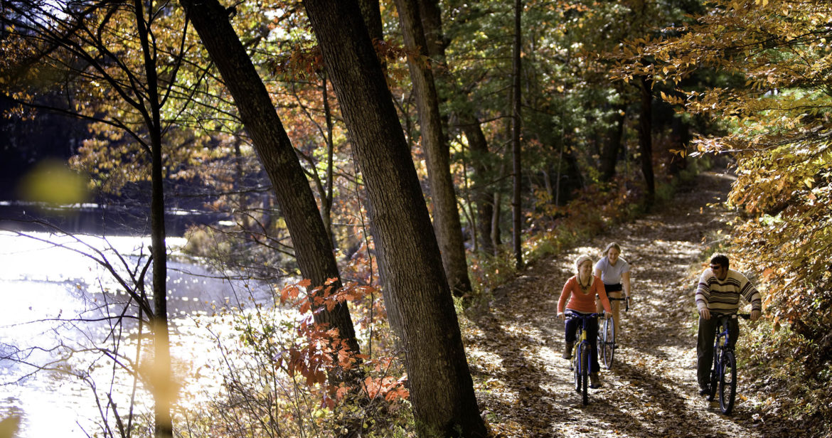 Students biking at Hartwick's Pine Lake Environmental Campus