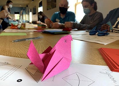 Hartwick students making oragami birds