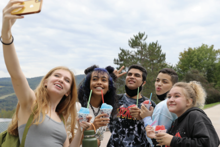 Hartwick students taking a selfie on Founders' Way
