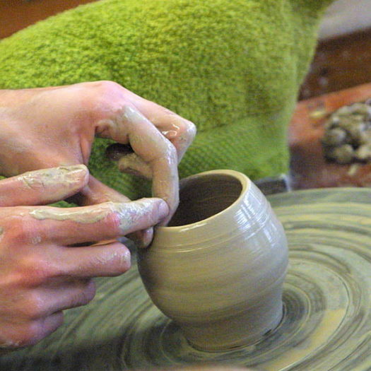 ceramic bowl being made on wheel