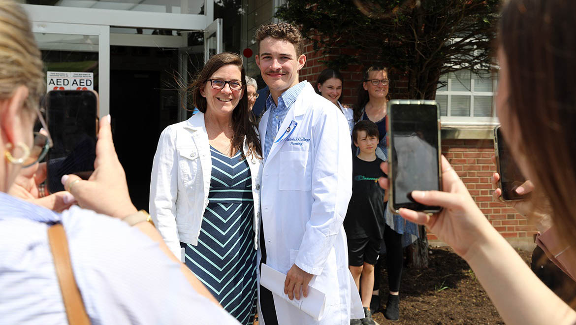 Hartwick College Nurse Graduate with family