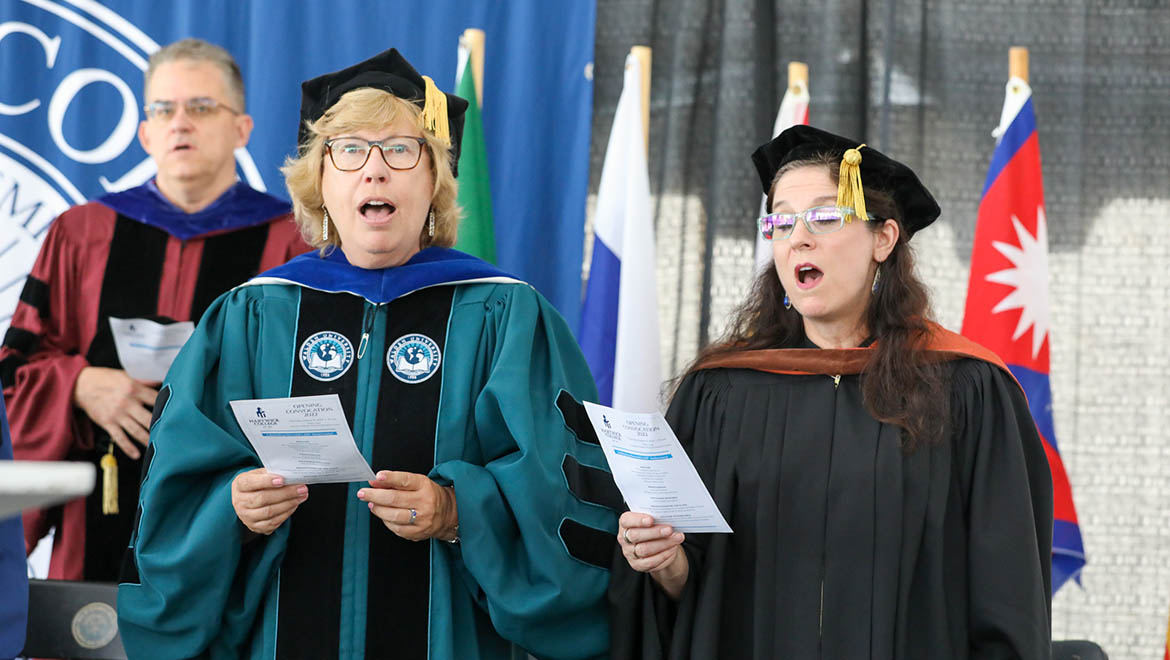 Dr. Laurel Bongiornol and Dr. Barbara Kahl, Assistant Professor of Theatre Arts singing the Hartwick alma mater during Opening Convocation