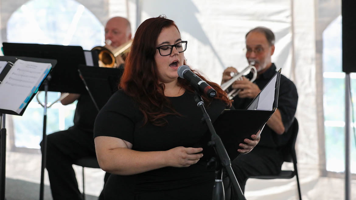 Student singing Hartwick alma mater during Opening Convocation