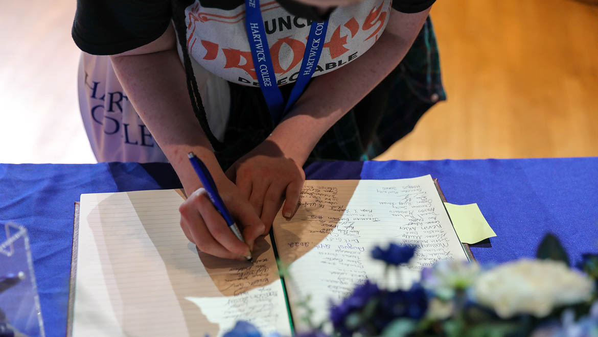 New Hartwick student signing College's Matriculation Book