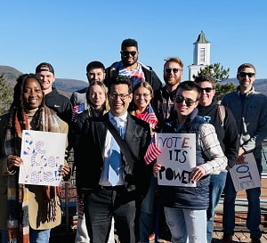 Hartwick College President Darren Reisberg with students