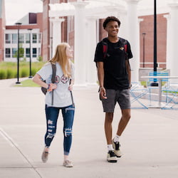 Hartwick College students walking on Founders' Way