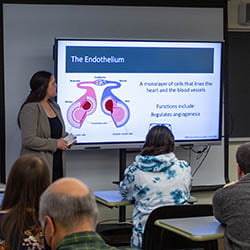 Hartwick College student presenting biology research