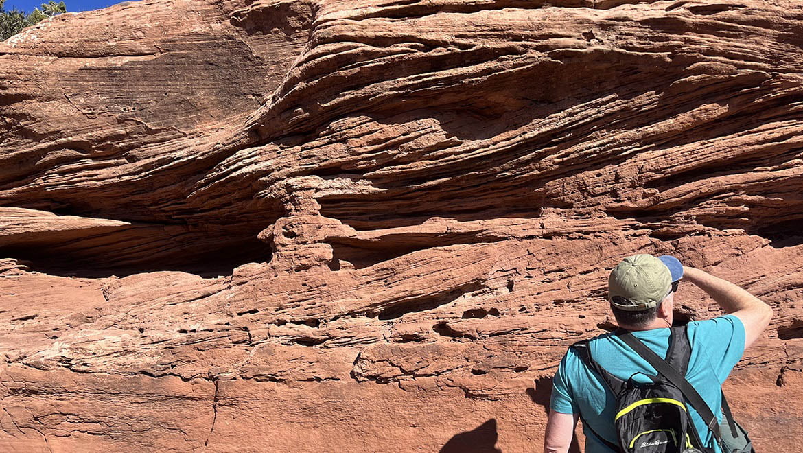 Dr. Griffing examines the cross-bedded sandstones of the Wingate Formation in Colorado National Monument