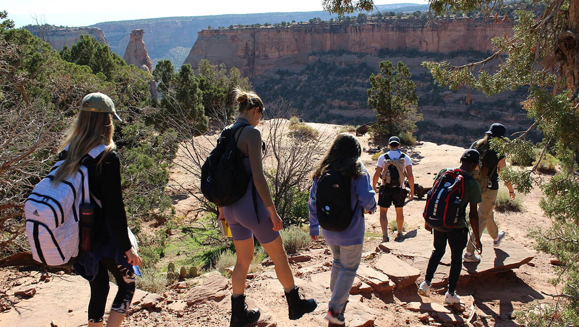 The Group hikes along the Canyon Rim Trail in Colorado National Monument