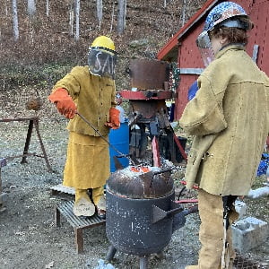 Hartwick College art students welding