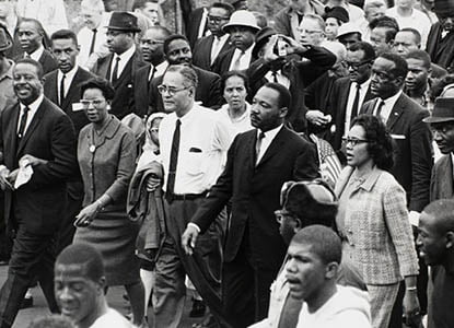 Martin Luther King, Jr. and Coretta Scott King marching in Selma AL