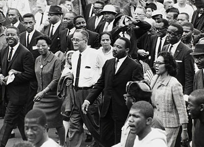 Martin Luther King, Jr. and Coretta Scott King marching in Selma AL