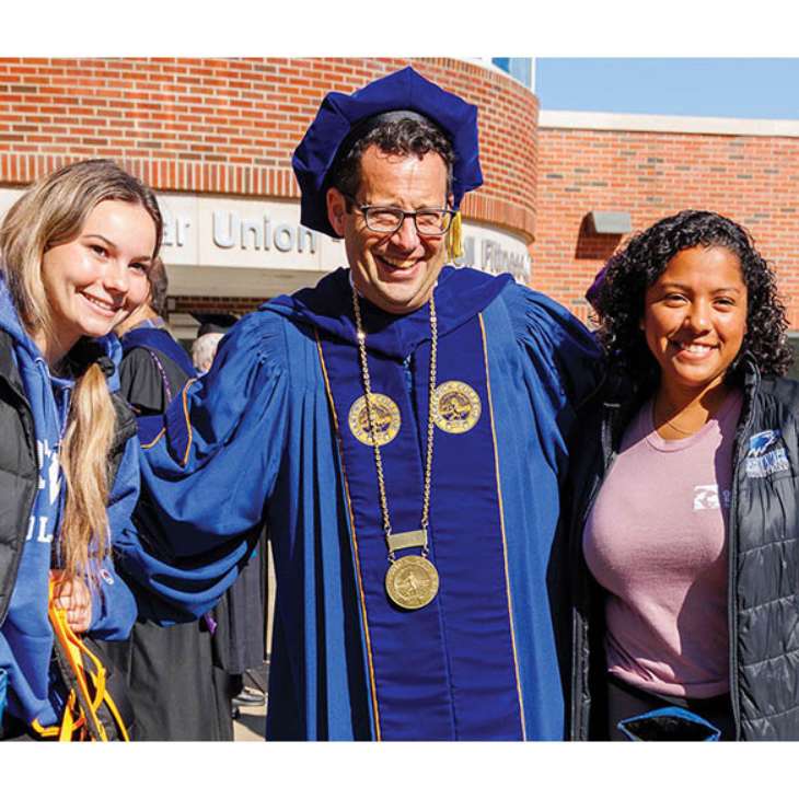 President Darren Reisberg with students after his Inauguration Ceremony