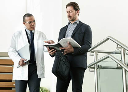 Abbviee staff discussing pharma report