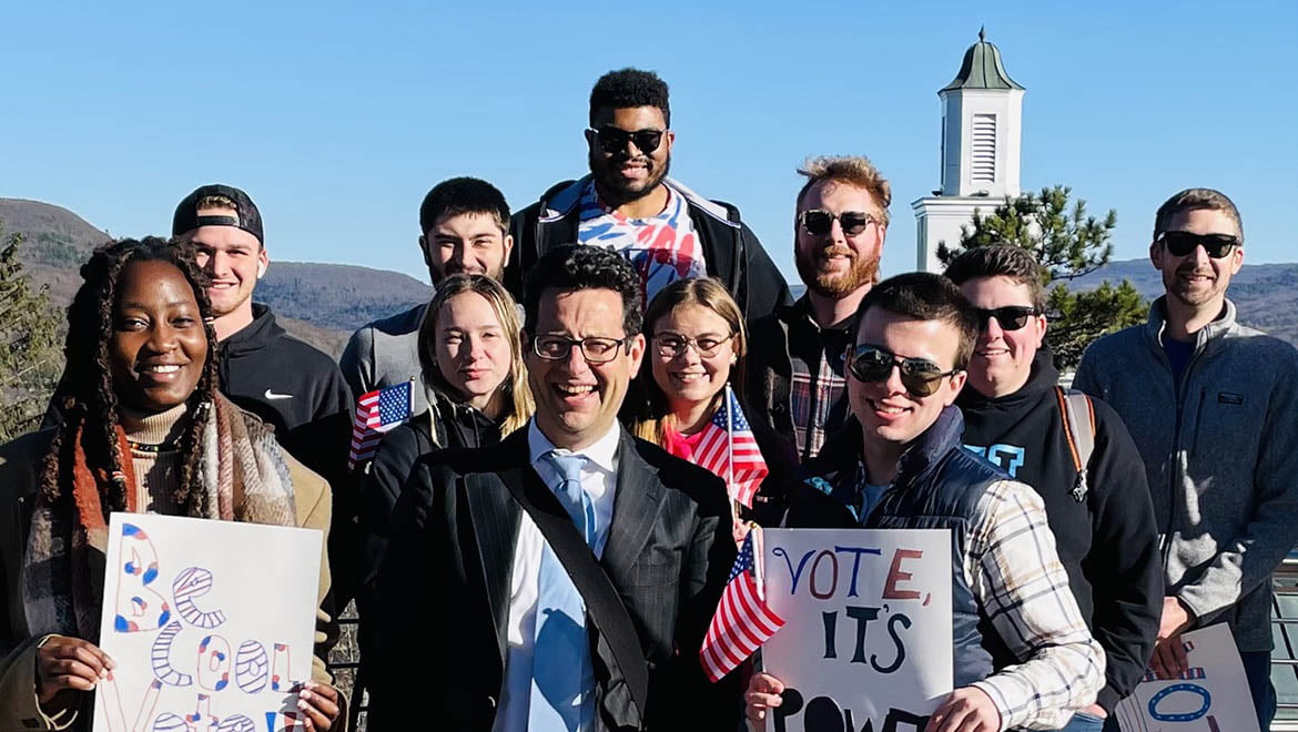 President Darren Reisberg meets Hartwick students and alumni employees for coffee and donuts before casting their votes on Election Day 2022