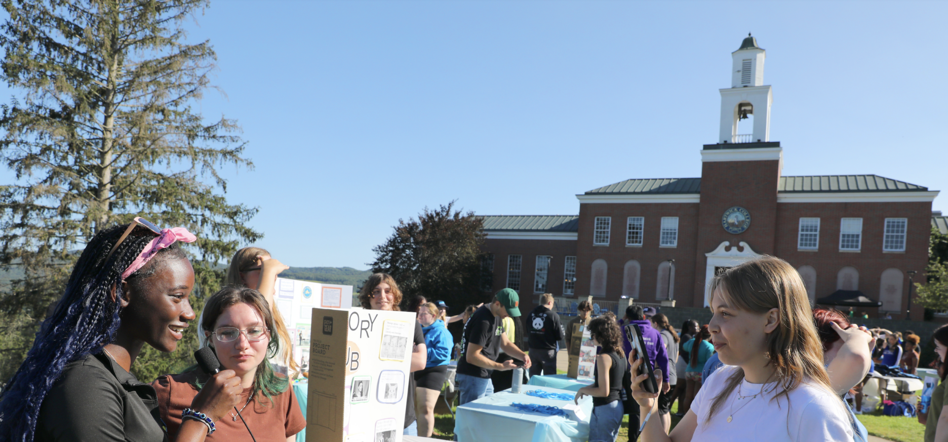 Hartwick College students during club fair on Frisbee Field