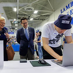 Accepted Hartwick College student making his deposit on Accepted Student Day