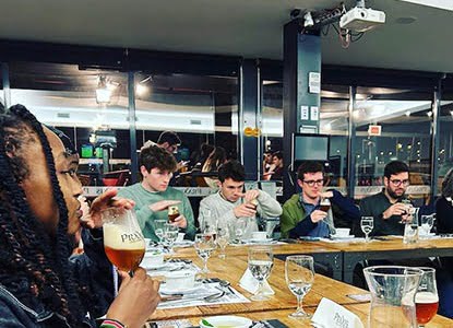 Hartwick students tasting food and wine in Portugal
