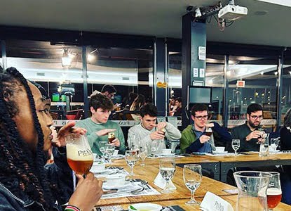 Hartwick students tasting food and wine in Portugal