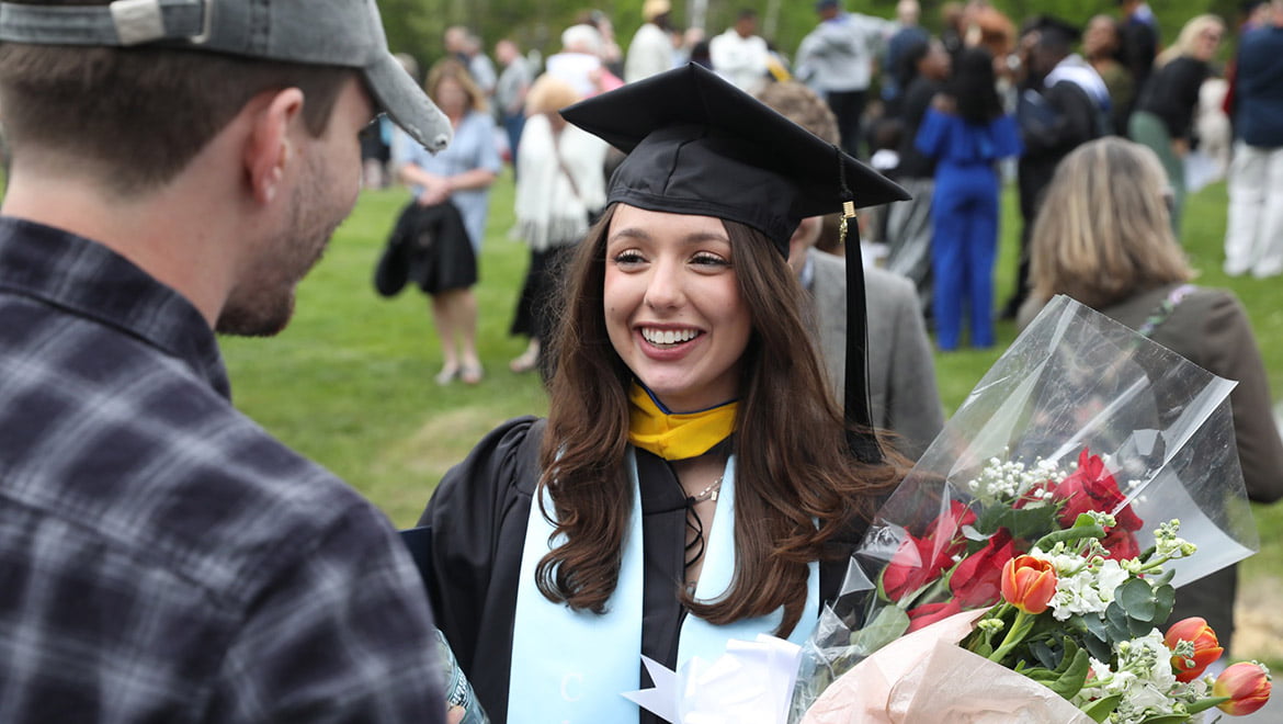 Hartwick College graduate after commencement ceremony