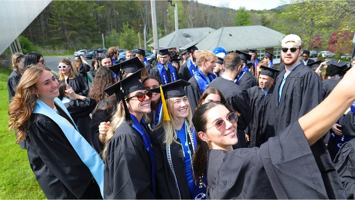 Class of 2023 in cap and gown before Last Walk on Founders' Way