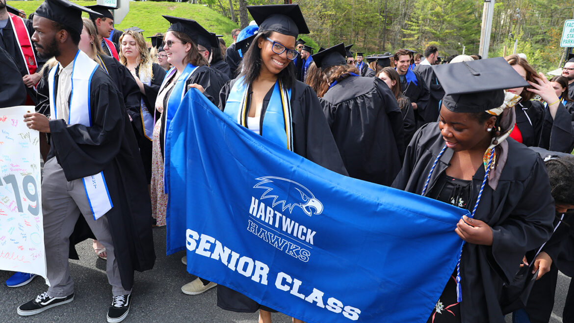 Class of 2023 with Senior Class banner at Last Walk on Founders' Way