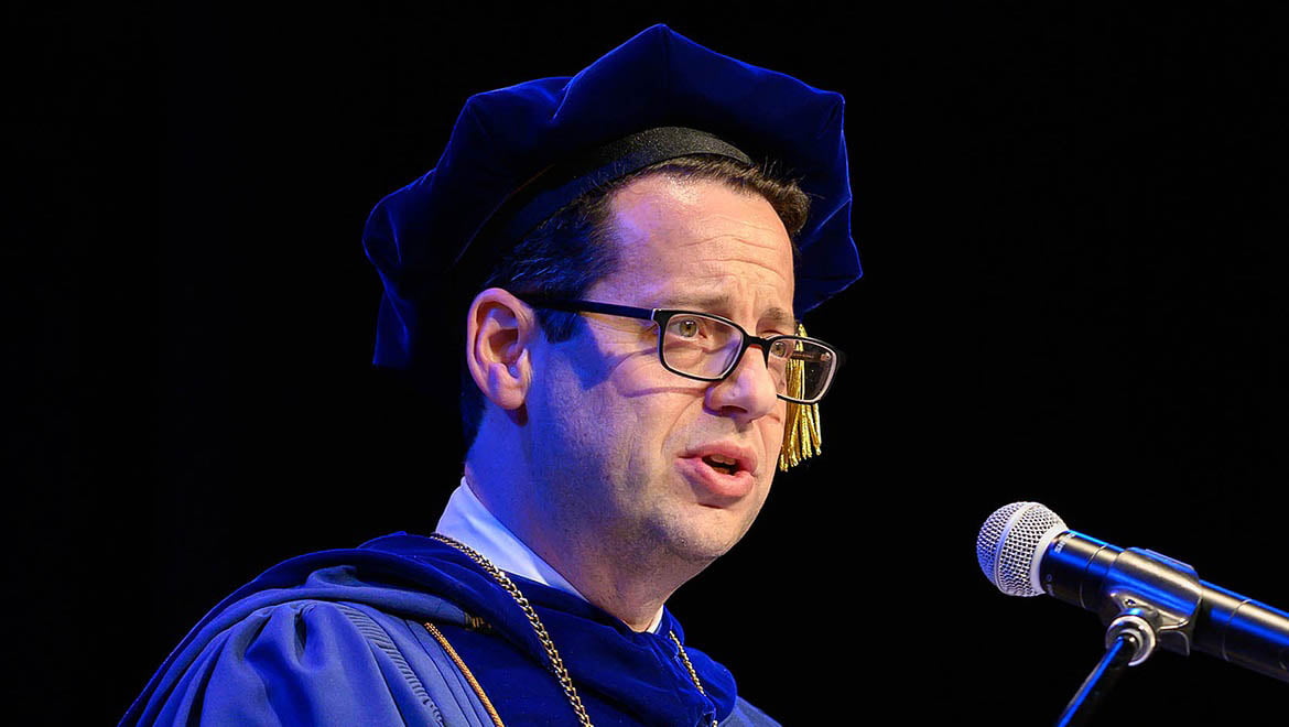 President Darren Reisberg making opening remarks at Honors Convocation, May 3, 2023