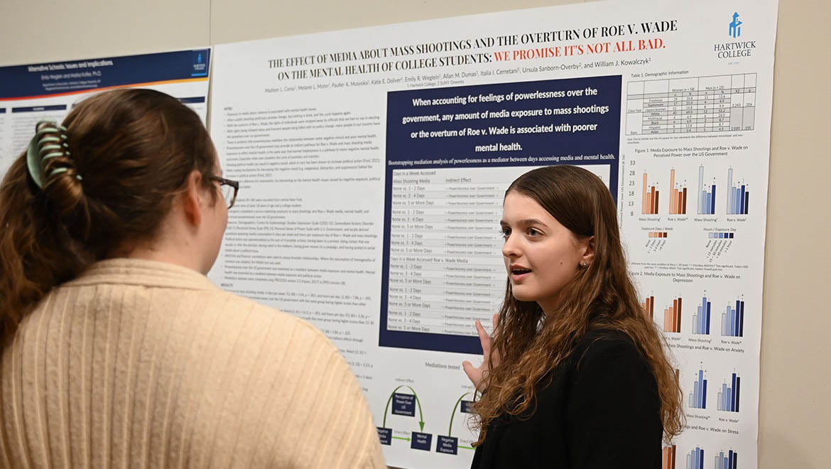 Hartwick College student presenting during poster session of Student Showcase 2023