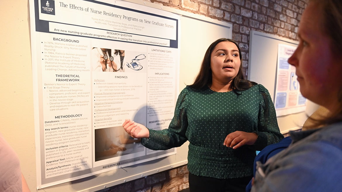 Hartwick College student presenting during poster session of Student Showcase 2023