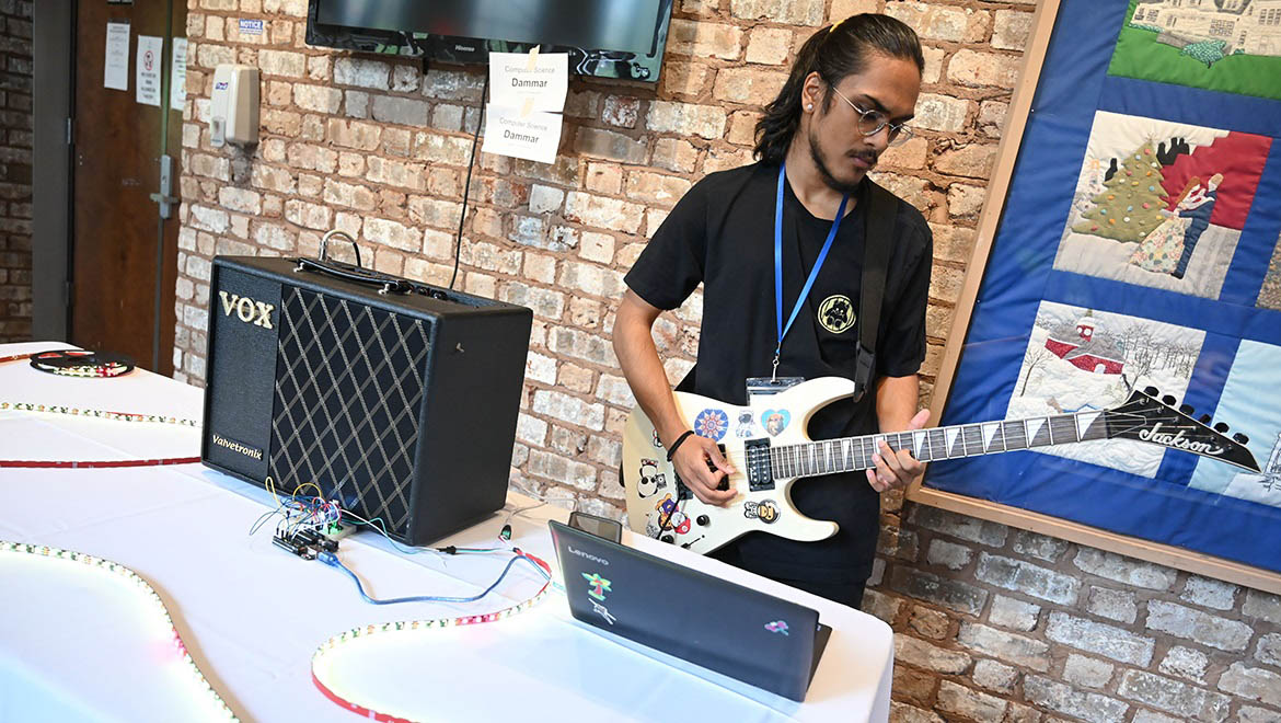 Hartwick College student playing music during performance session of Student Showcase 2023